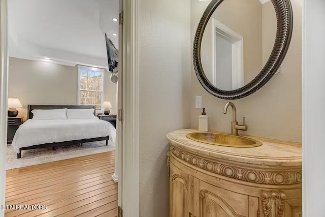 bathroom featuring hardwood / wood-style floors and vanity