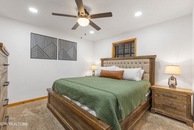 bedroom featuring ceiling fan and carpet