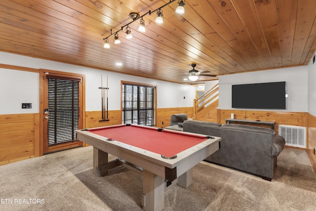 recreation room with carpet flooring, wooden walls, and wood ceiling