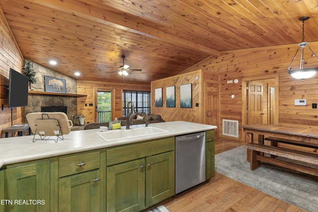 kitchen featuring hanging light fixtures, green cabinetry, stainless steel dishwasher, light hardwood / wood-style floors, and wood ceiling