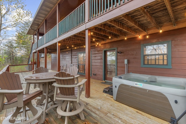 deck with a hot tub