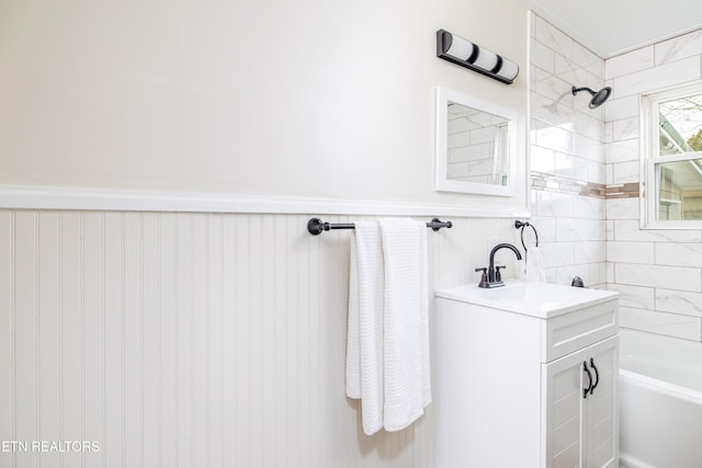 bathroom with vanity and tiled shower / bath combo