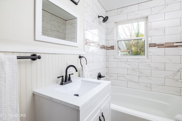 full bathroom featuring a wainscoted wall, bathtub / shower combination, and vanity