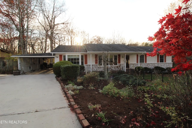 ranch-style house with a carport