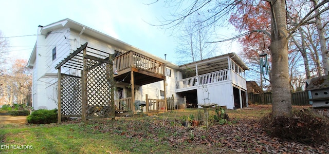 back of property featuring a deck