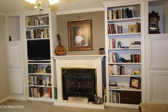 sitting room with carpet flooring, a textured ceiling, and ornamental molding