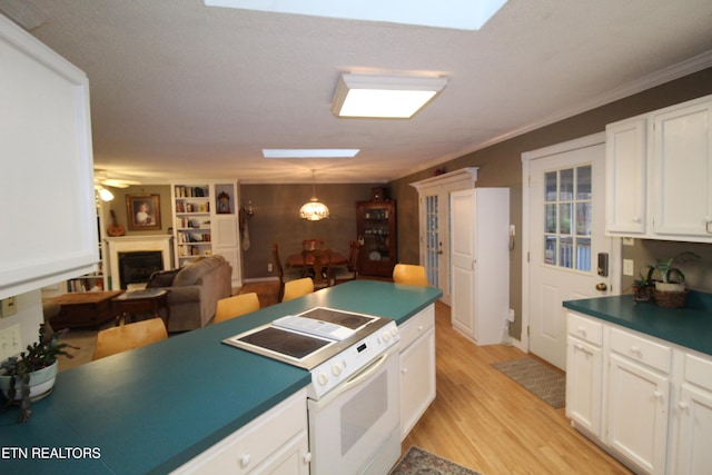 kitchen with ceiling fan, light hardwood / wood-style flooring, white electric stove, pendant lighting, and white cabinets