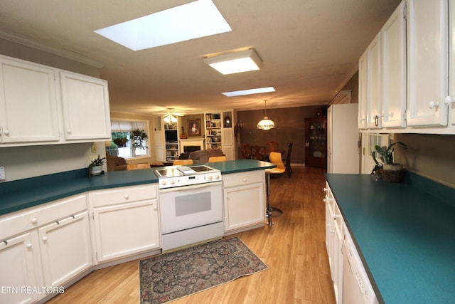 kitchen featuring white cabinets, kitchen peninsula, and white electric stove