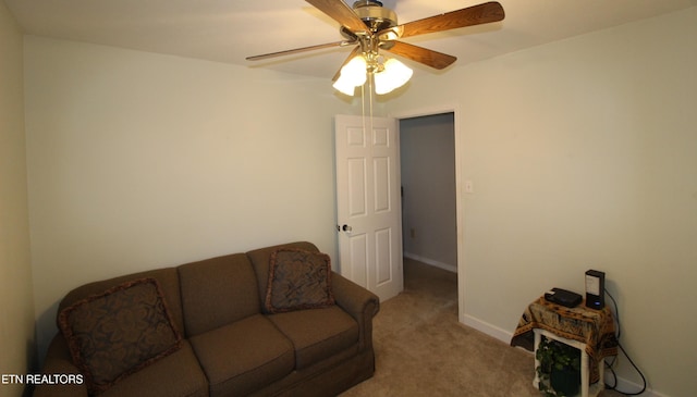 carpeted living room featuring ceiling fan