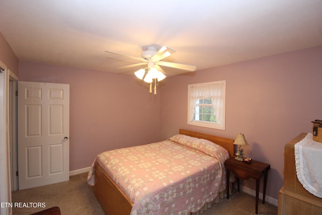 bedroom featuring ceiling fan and light colored carpet