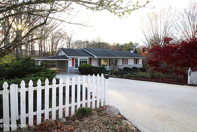 single story home featuring a carport