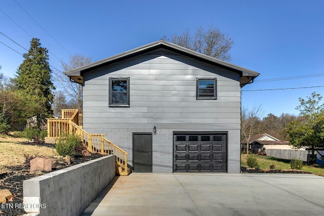 view of property exterior with a garage