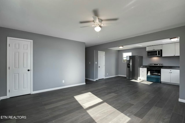 kitchen featuring ceiling fan, dark wood-type flooring, white cabinets, and stainless steel appliances