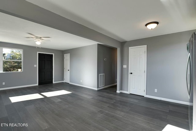 unfurnished room featuring dark hardwood / wood-style flooring and ceiling fan