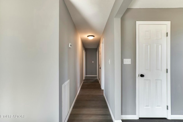 corridor featuring dark wood-type flooring