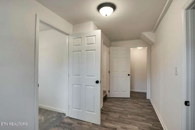 hall with dark hardwood / wood-style flooring