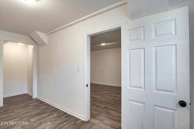 unfurnished room featuring dark hardwood / wood-style flooring