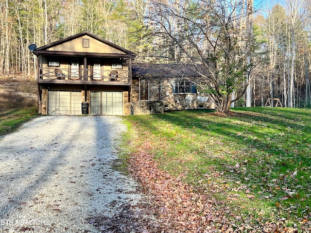 view of side of property with a yard and a garage