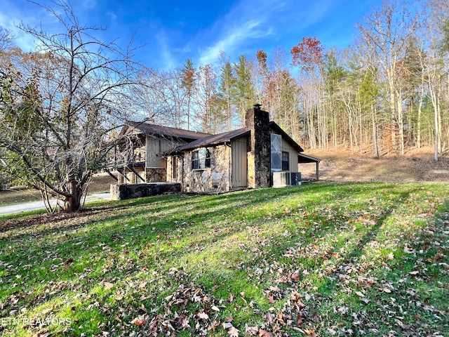 view of home's exterior with a lawn