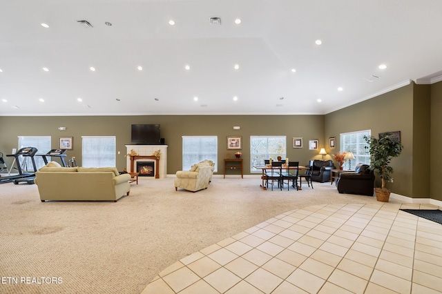 carpeted living room with ornamental molding