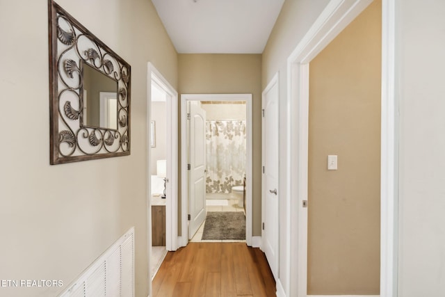 corridor featuring hardwood / wood-style flooring