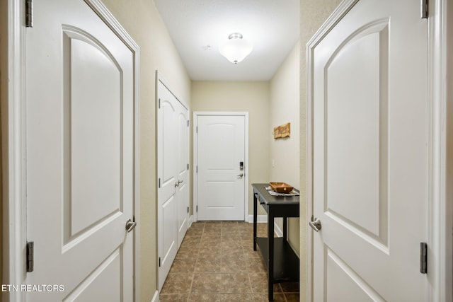 corridor featuring tile patterned floors