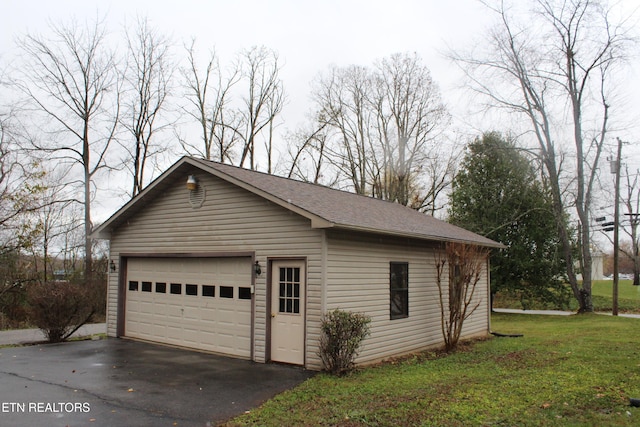 garage with a yard