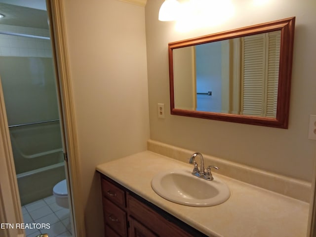 bathroom with tile patterned floors, vanity, and toilet