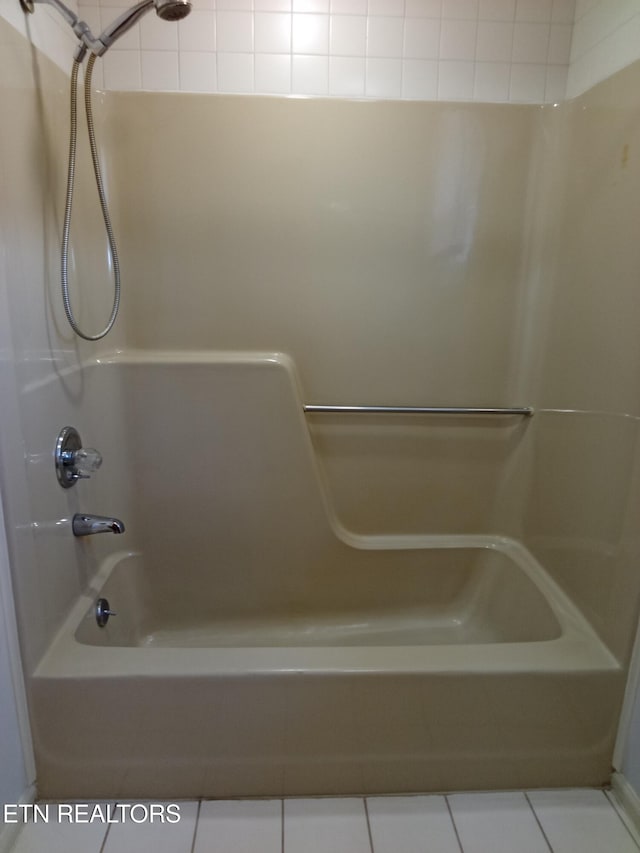 bathroom featuring tile patterned floors and shower / washtub combination