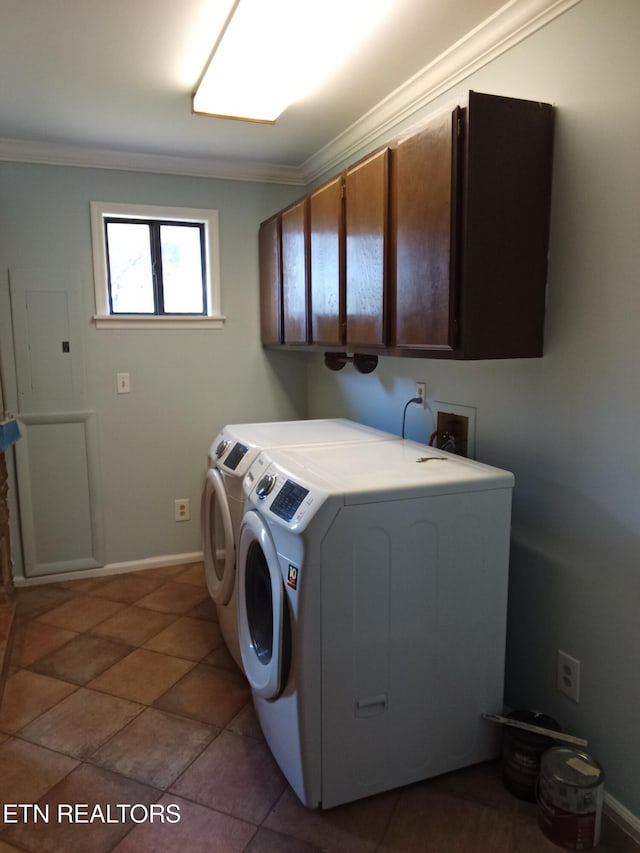 laundry room featuring tile patterned flooring, cabinets, ornamental molding, and washing machine and dryer