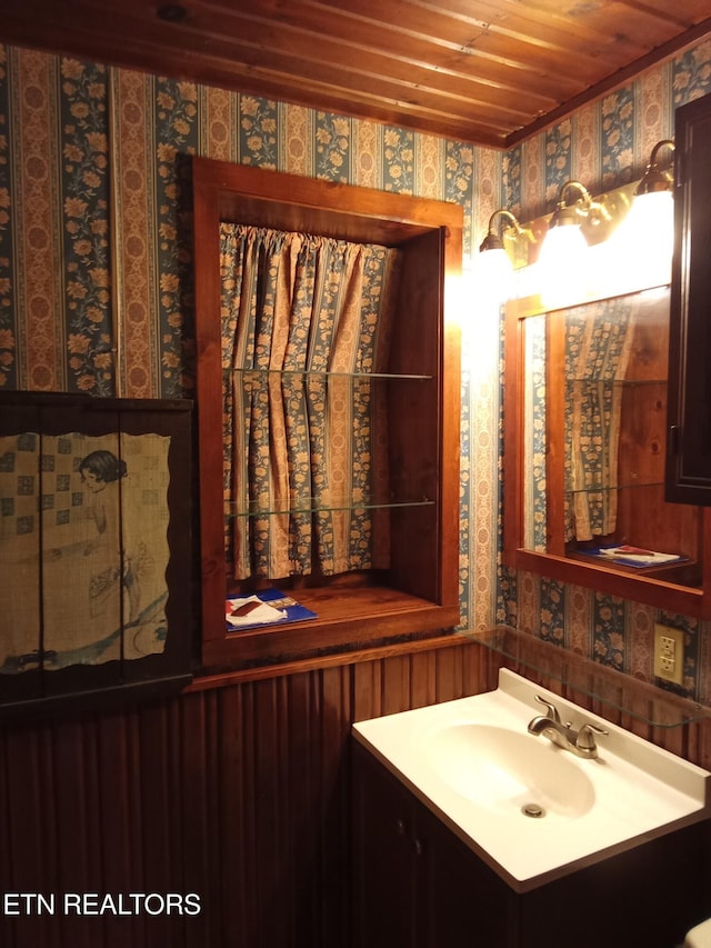 bathroom featuring vanity and wood ceiling