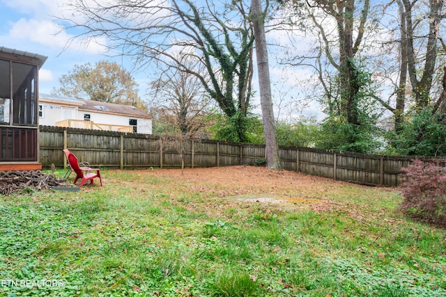 view of yard featuring a sunroom