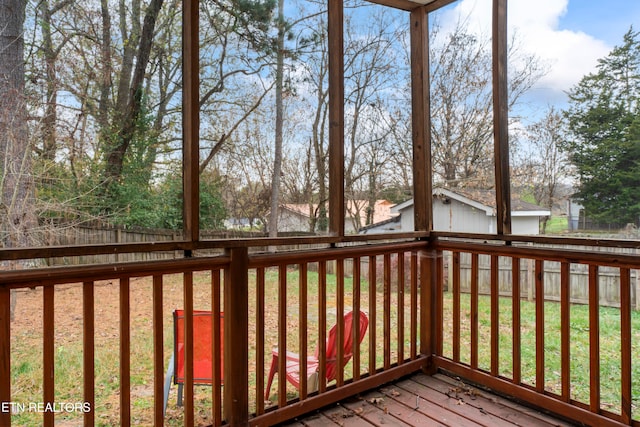 wooden terrace featuring a yard