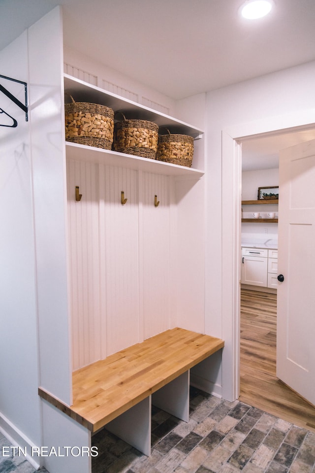 mudroom featuring dark wood-type flooring