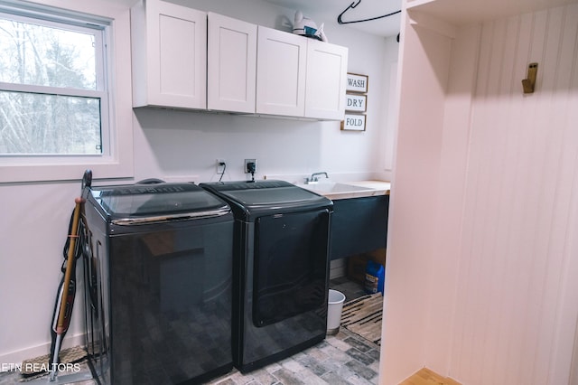 laundry area featuring cabinets and washer and dryer