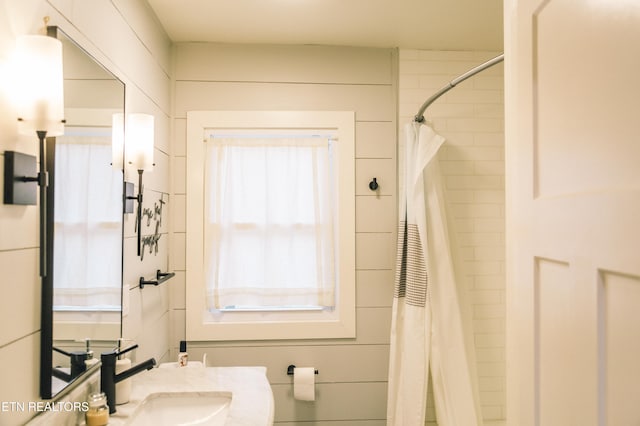 bathroom with vanity and walk in shower