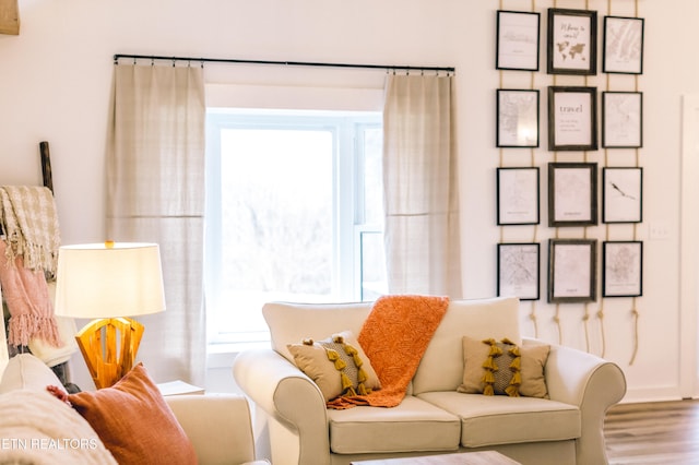 sitting room with hardwood / wood-style flooring