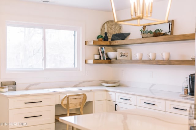 kitchen featuring light stone counters