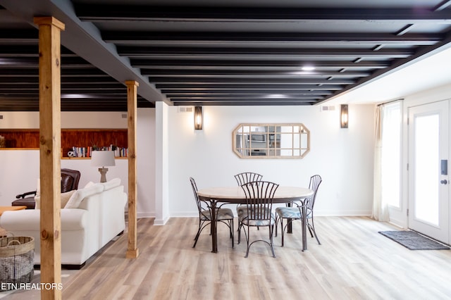 dining area featuring light wood-type flooring