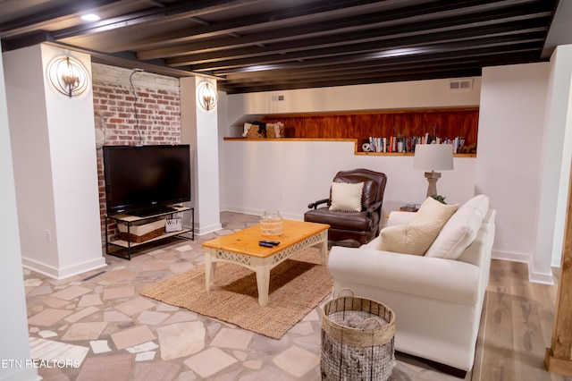 living room with beam ceiling and light hardwood / wood-style flooring