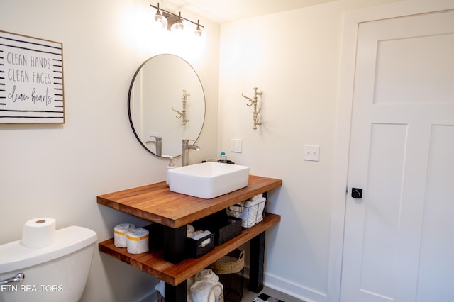 bathroom featuring sink and toilet