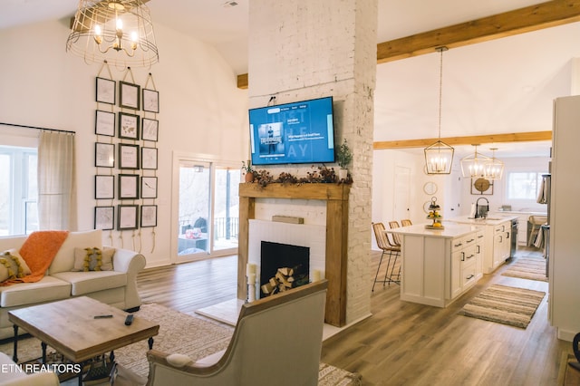 living room featuring hardwood / wood-style flooring, a wealth of natural light, and high vaulted ceiling