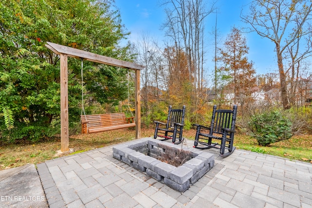 view of patio / terrace with an outdoor fire pit