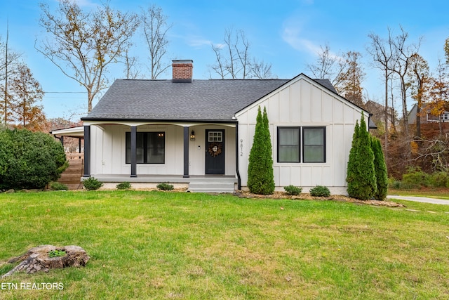 view of front of house featuring a front lawn and a porch