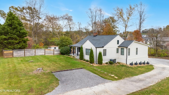 view of home's exterior featuring a lawn and cooling unit