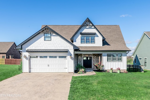 view of front facade with a front yard and a garage