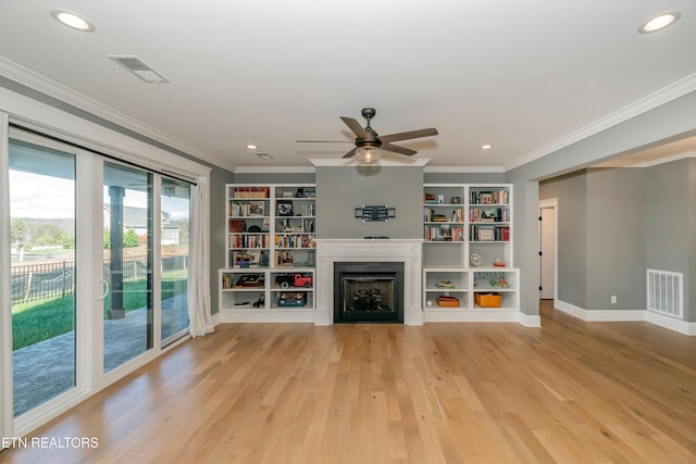 unfurnished living room featuring ceiling fan, light hardwood / wood-style floors, and ornamental molding