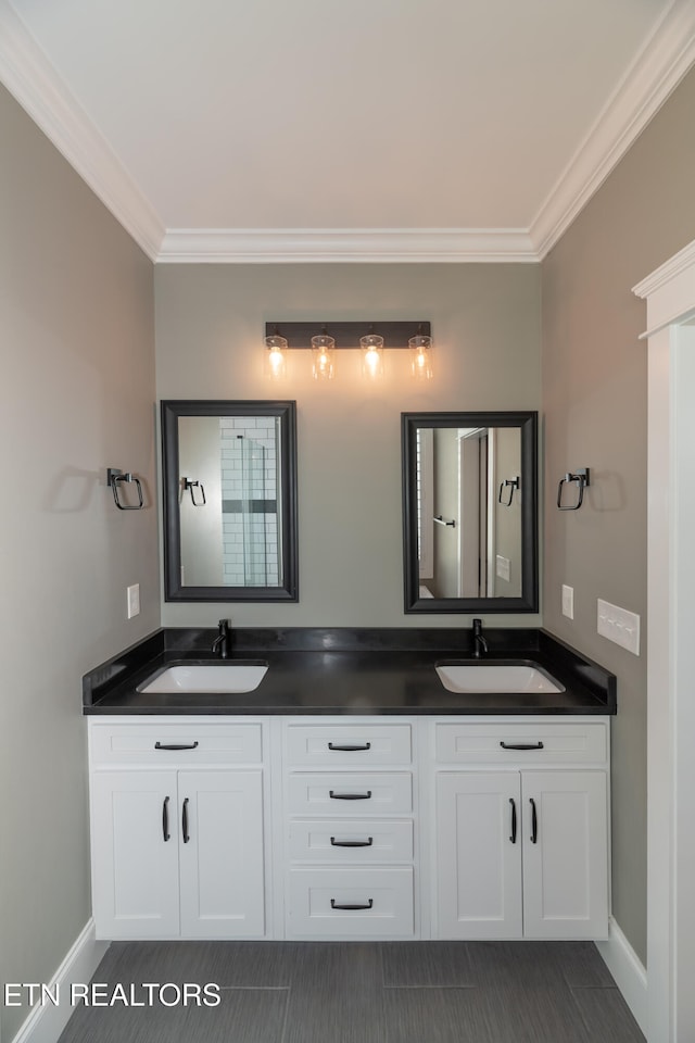 bathroom featuring tile patterned floors, vanity, and ornamental molding