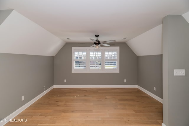 bonus room featuring ceiling fan, light hardwood / wood-style floors, and vaulted ceiling