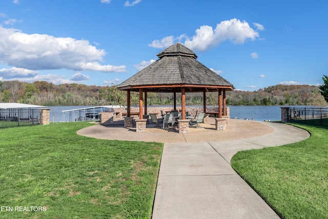 view of property's community featuring a gazebo, a yard, and a water view